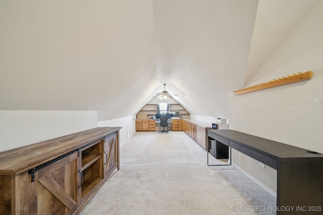 bonus room with vaulted ceiling and light carpet