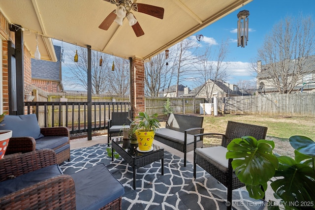 view of patio / terrace with a fenced backyard, ceiling fan, and outdoor lounge area