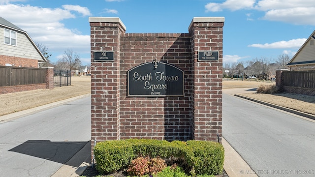 community sign with fence