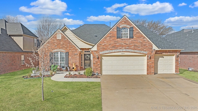 traditional home featuring brick siding, driveway, and a shingled roof