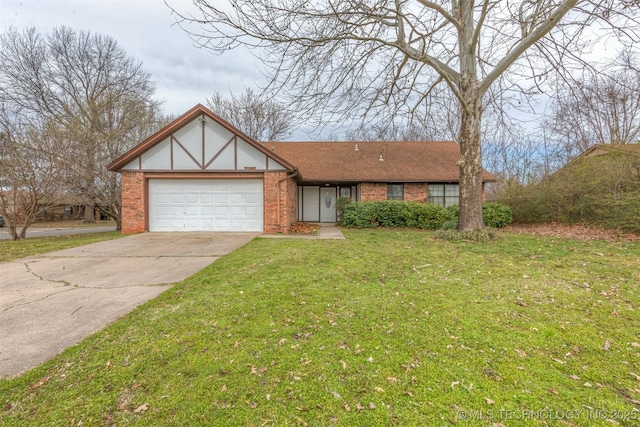 view of front of home featuring a front yard, an attached garage, brick siding, and driveway