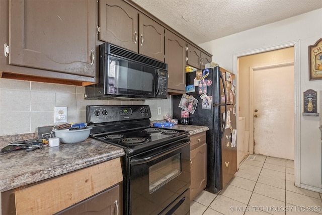 kitchen with light tile patterned floors, backsplash, a textured ceiling, and black appliances