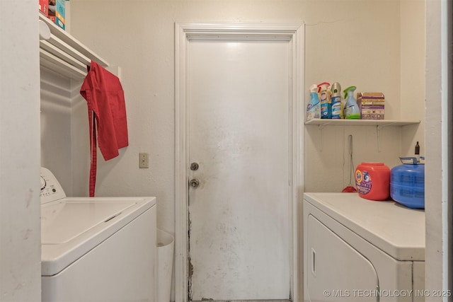 washroom with laundry area and washer and clothes dryer