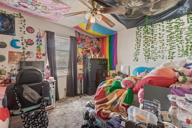 bedroom featuring ceiling fan and carpet flooring