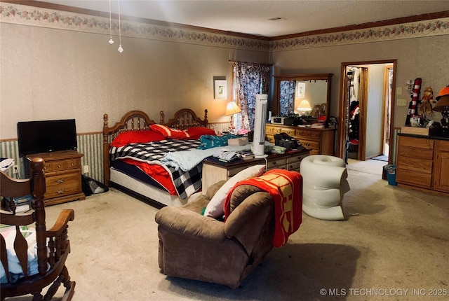 bedroom featuring visible vents and light carpet