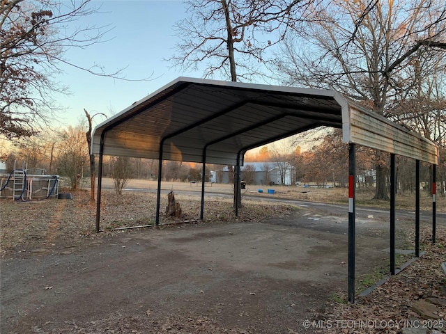 parking at dusk with a detached carport