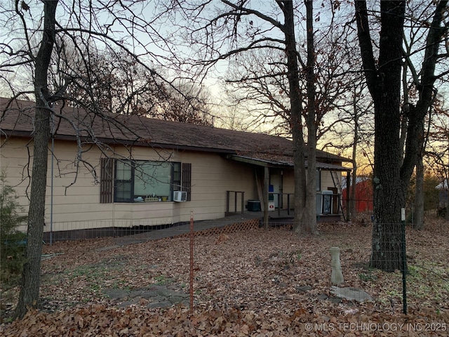 back of house featuring cooling unit