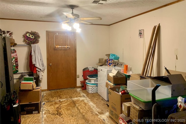 storage room with washer and clothes dryer, visible vents, and a ceiling fan