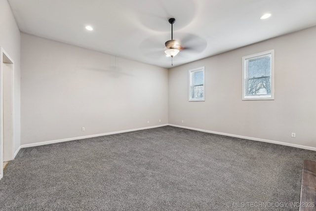 empty room with recessed lighting, dark carpet, baseboards, and a ceiling fan