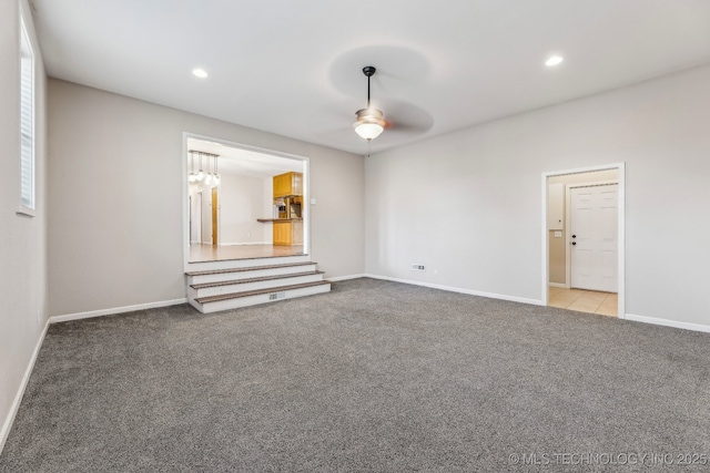 spare room with recessed lighting, baseboards, carpet, and a ceiling fan