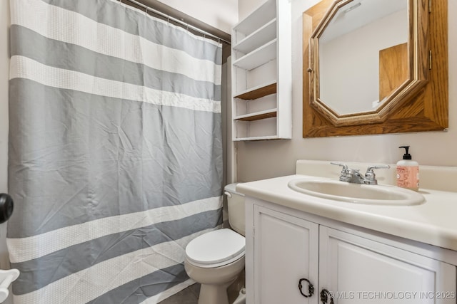 bathroom with vanity, a shower with shower curtain, and toilet