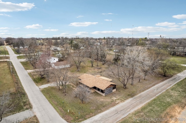 birds eye view of property with a rural view