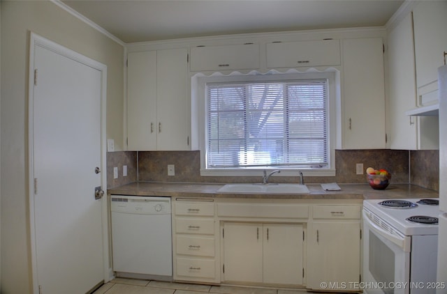 kitchen featuring a sink, decorative backsplash, white appliances, and light tile patterned floors