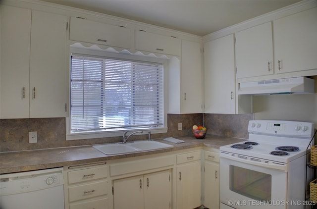 kitchen featuring under cabinet range hood, a sink, backsplash, white cabinetry, and white appliances