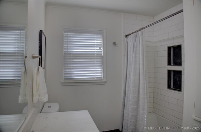 bathroom with toilet and shower / bath combo