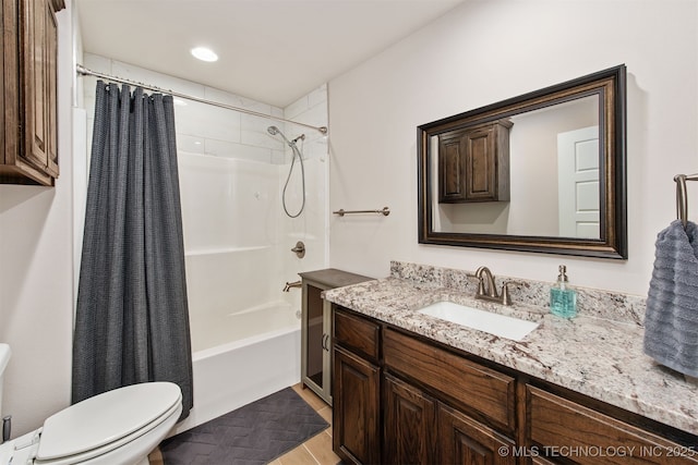 full bath featuring shower / tub combo with curtain, vanity, and toilet
