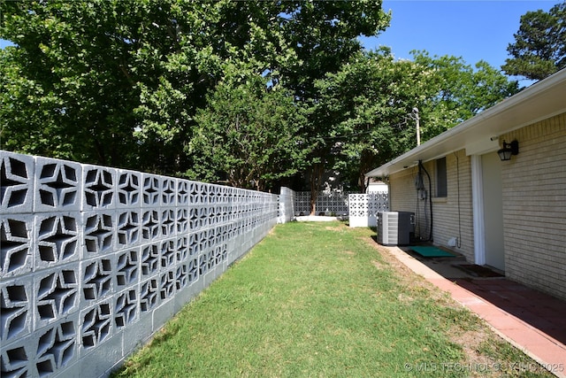 view of yard featuring cooling unit and a fenced backyard