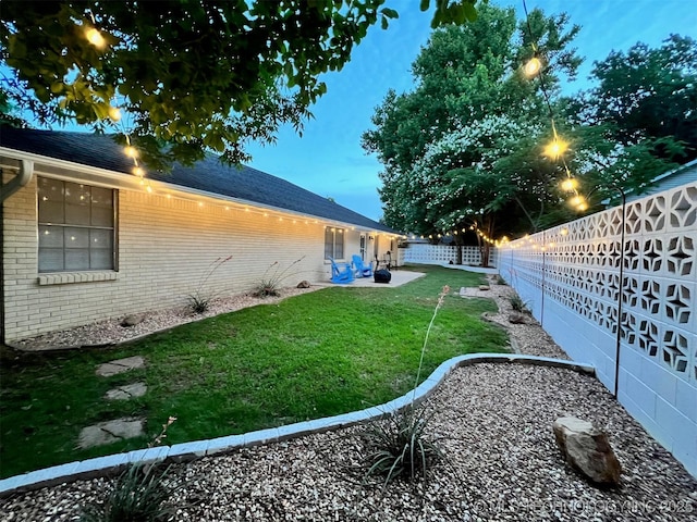 view of yard featuring a fenced backyard and a patio area