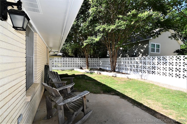 view of patio featuring fence and visible vents