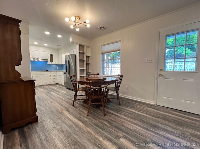 dining area with visible vents, baseboards, dark wood finished floors, a chandelier, and a textured ceiling