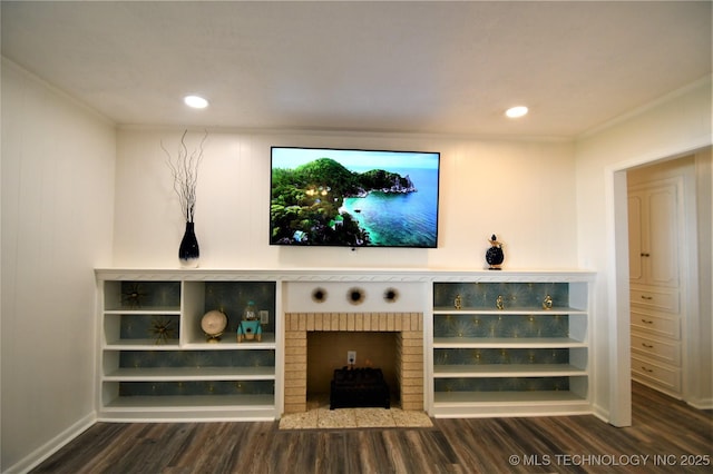 unfurnished living room with recessed lighting, wood finished floors, a fireplace, and ornamental molding