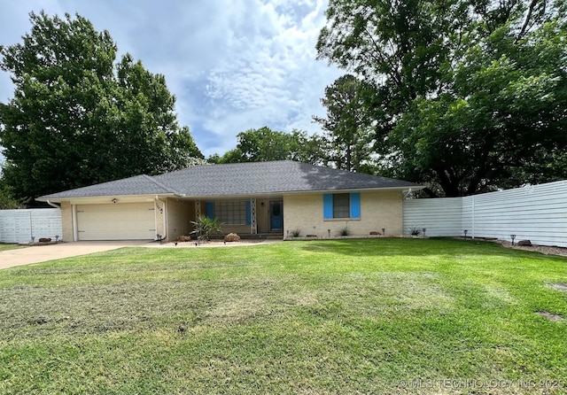 single story home with brick siding, an attached garage, a front lawn, and fence