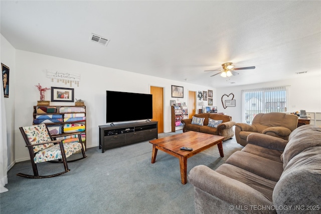 carpeted living area with visible vents and a ceiling fan