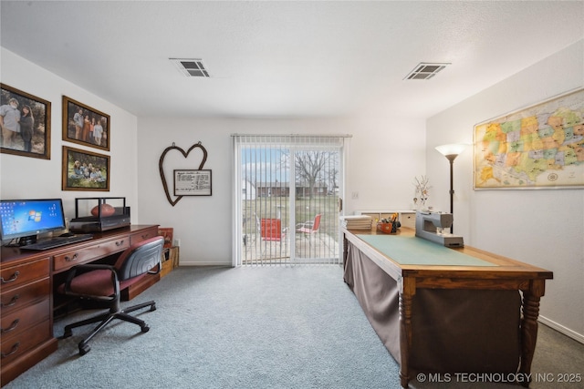 office area featuring visible vents, carpet flooring, and baseboards