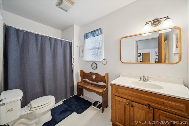 bathroom with visible vents, curtained shower, toilet, and vanity