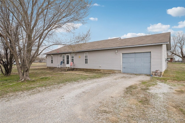 ranch-style house with a garage and dirt driveway