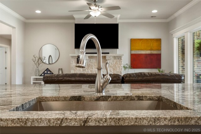2910 E Olympia St, Broken Arrow, OK 74014 - details featuring crown molding, stone counters, recessed lighting, a ceiling fan, and a sink