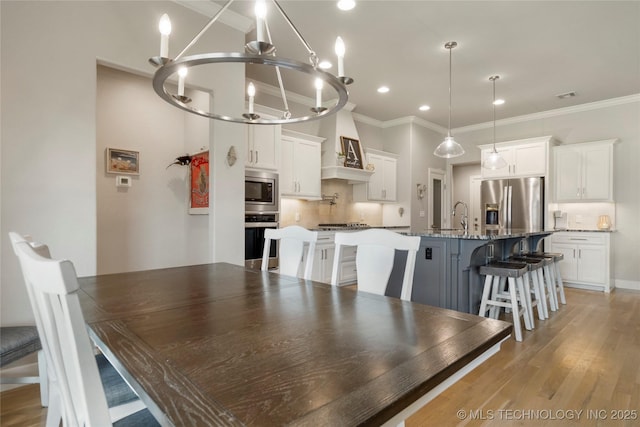 2910 E Olympia St, Broken Arrow, OK 74014 - dining room with visible vents, crown molding, recessed lighting, an inviting chandelier, and light wood-style floors