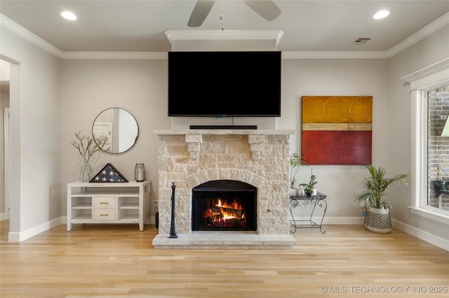 2910 E Olympia St, Broken Arrow, OK 74014 - living area featuring wood finished floors, a fireplace, visible vents, and ornamental molding