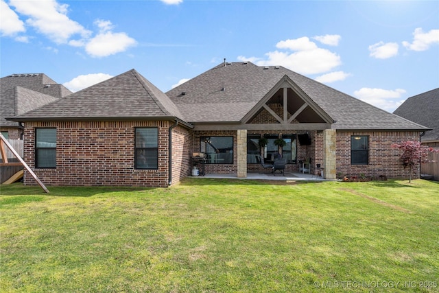 2910 E Olympia St, Broken Arrow, OK 74014 - back of house featuring a patio, brick siding, and roof with shingles