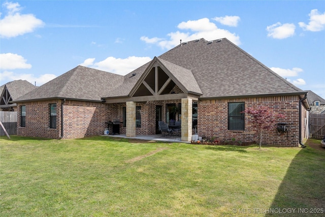 2910 E Olympia St, Broken Arrow, OK 74014 - rear view of property with brick siding, fence, roof with shingles, a yard, and a patio