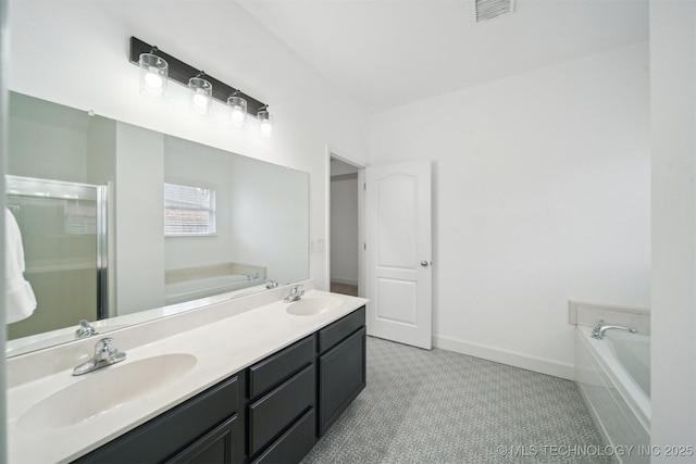 full bathroom featuring a garden tub, double vanity, a shower stall, and baseboards
