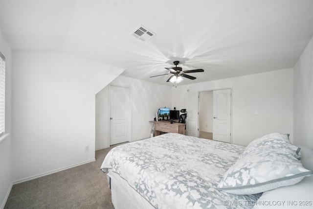 carpeted bedroom featuring visible vents, a ceiling fan, and baseboards