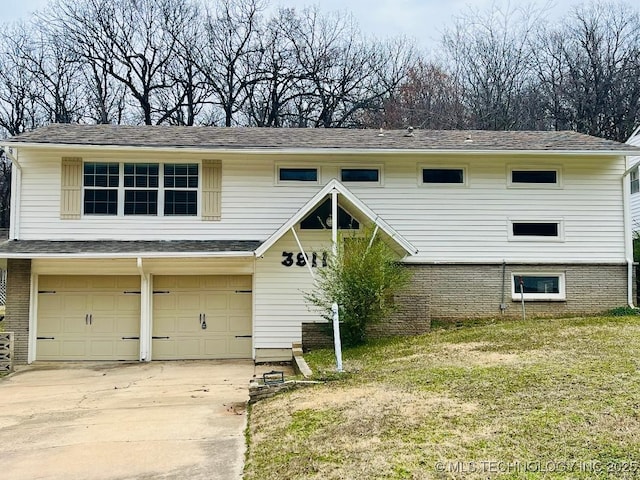 view of front of home featuring brick siding, concrete driveway, and an attached garage