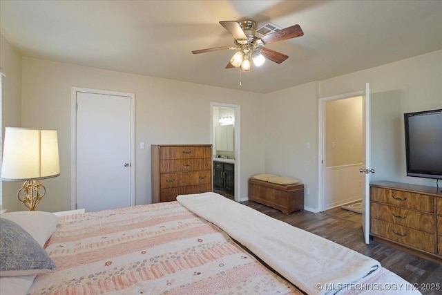 341 S Diamondhead Dr, Burneyville, OK 73430 - bedroom with dark wood-style floors, ensuite bathroom, and ceiling fan