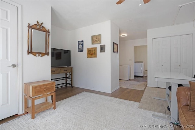341 S Diamondhead Dr, Burneyville, OK 73430 - hallway featuring washer / dryer, baseboards, and wood finished floors