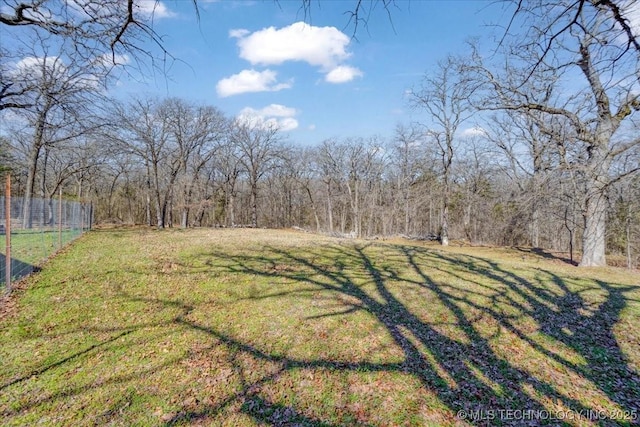 341 S Diamondhead Dr, Burneyville, OK 73430 - view of yard featuring fence and a view of trees
