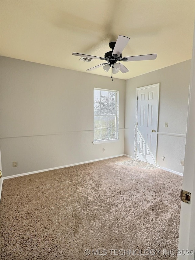 unfurnished bedroom with visible vents, baseboards, a ceiling fan, and carpet flooring