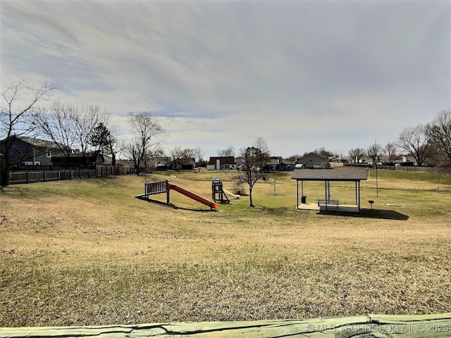 view of play area featuring a yard and fence