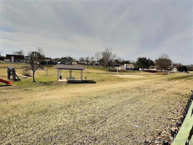 view of property's community with a lawn