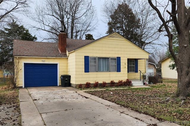 view of front of home with roof with shingles, a chimney, concrete driveway, and an attached garage