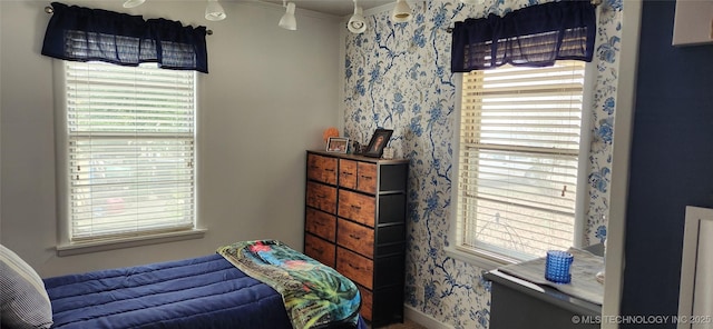 bedroom with wallpapered walls