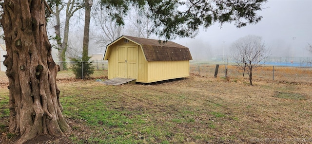 view of shed featuring a fenced backyard