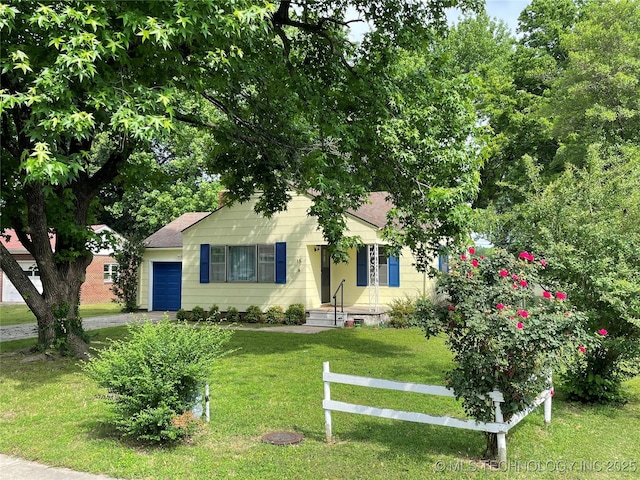 15 Irving St, Pryor, OK 74361 - view of front of house with a garage, a front lawn, and driveway
