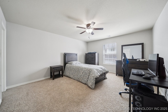 carpeted bedroom with a ceiling fan, visible vents, and baseboards