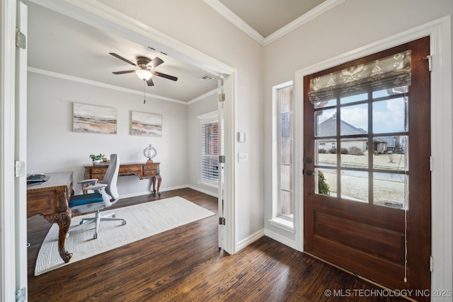 foyer featuring dark wood-type flooring, baseboards, visible vents, and ornamental molding